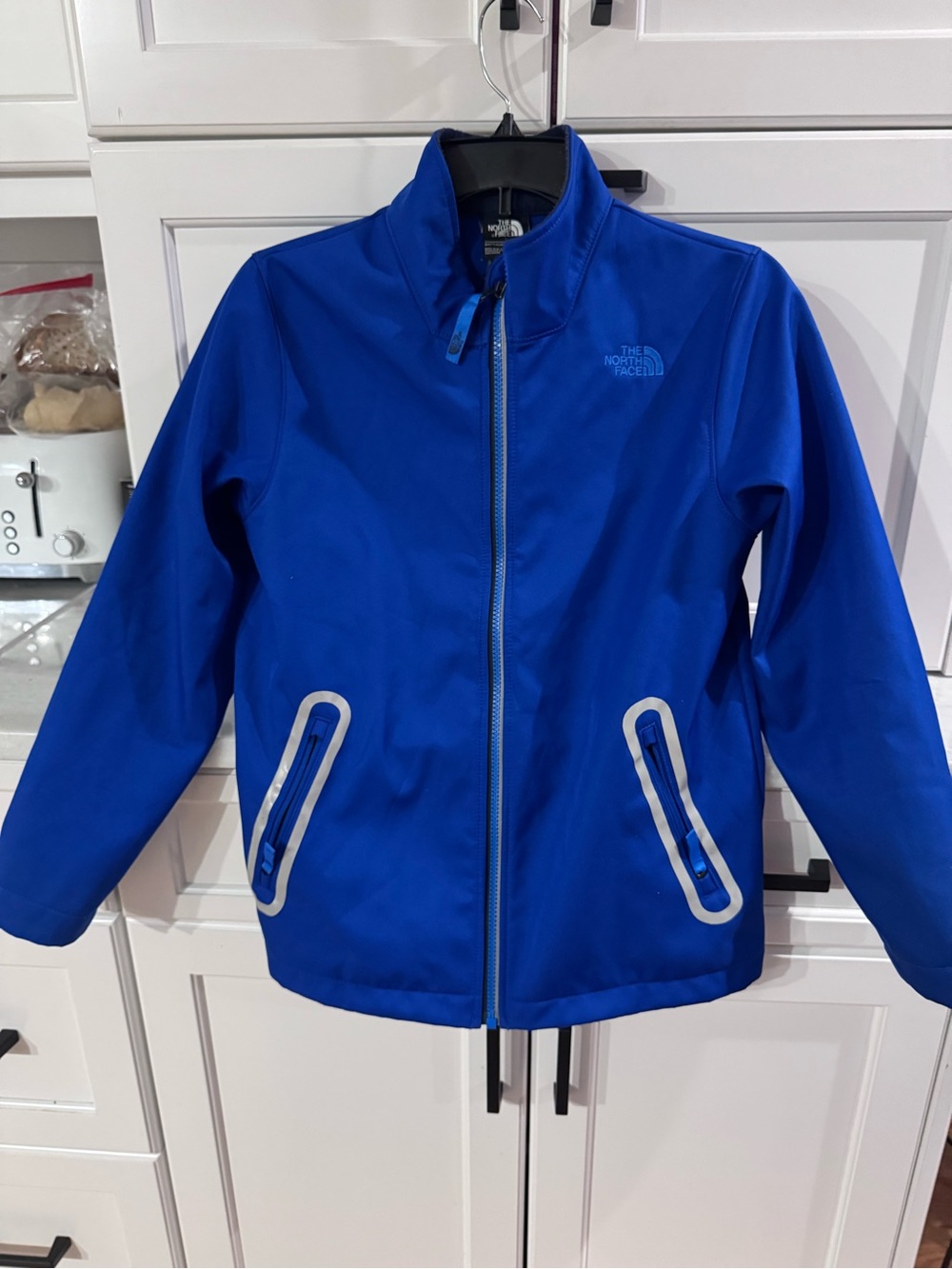 The North Face Kids Blue Raincoat with Reflective Trim